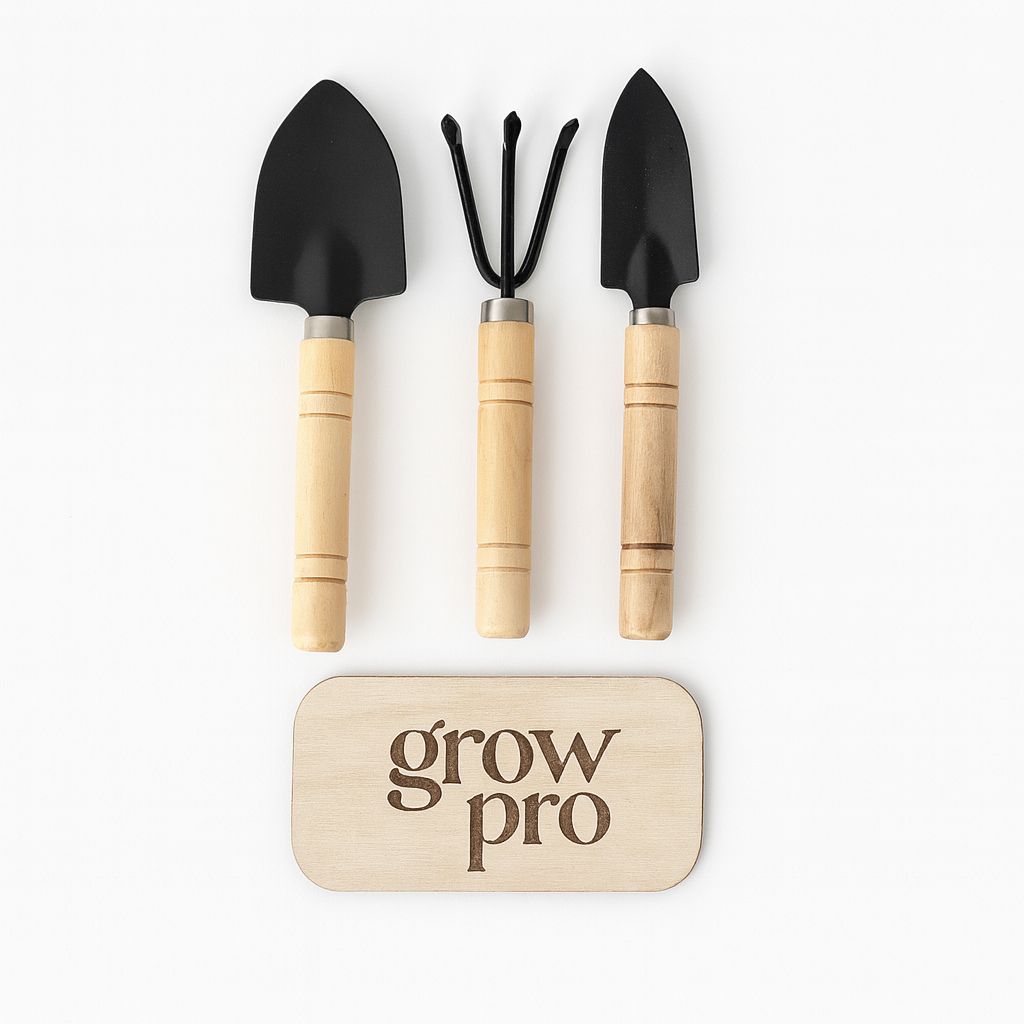 “Three-piece gardening tool set with wooden handles and black metal heads, including a trowel, cultivator, and transplanting trowel, displayed on a white background with engraved wooden Grow Pro logo plaque.”