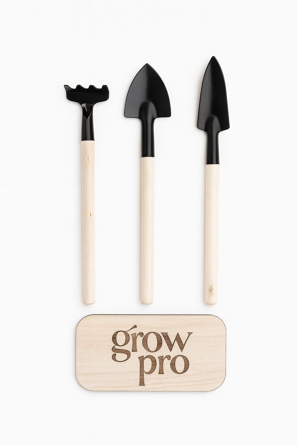 Set of three mini gardening tools with natural wooden handles and black metal heads, displayed on a white background with engraved wooden Grow Pro logo plaque.”